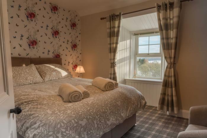 Bedroom inside Cardney Steading wedding accommodation