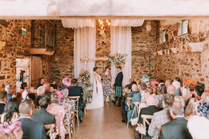 couple geting married in the old mill cardney steading