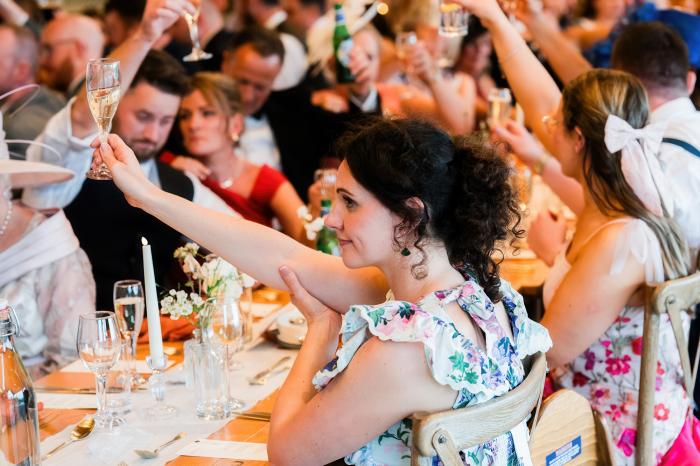 wedding guests toasting newlyweds at cardney steading